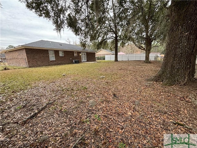 view of yard featuring central air condition unit