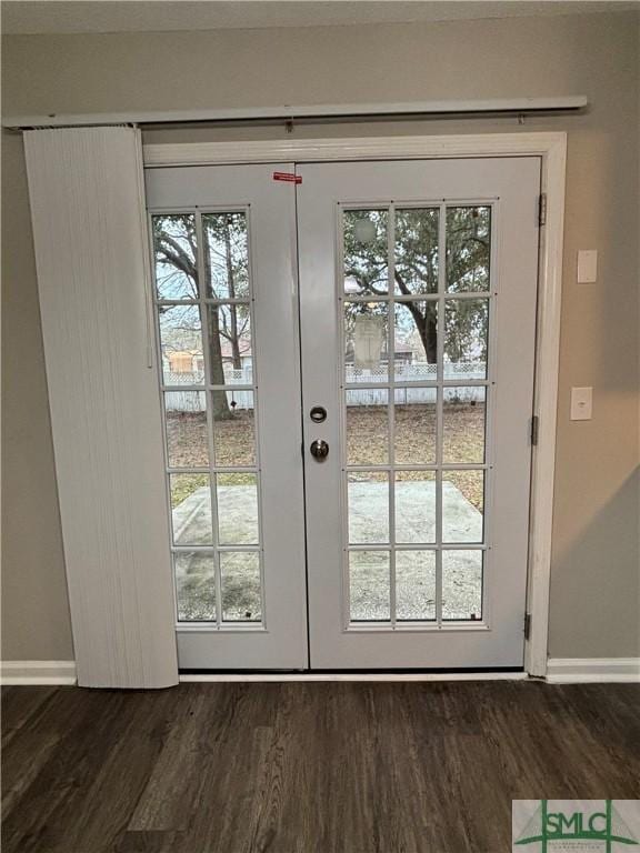 doorway to outside featuring dark hardwood / wood-style flooring