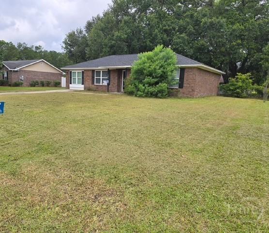 1257 Roberts Way, Pooler, GA 31322 - single story home with a front lawn, brick siding, and view of wooded area