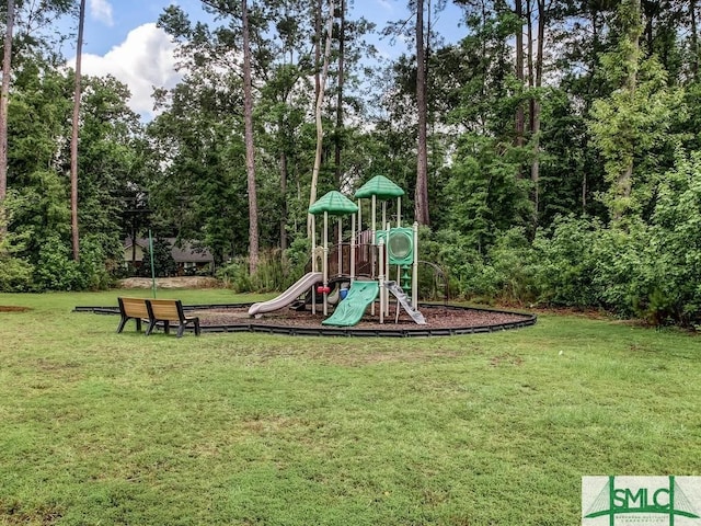 view of jungle gym featuring a lawn