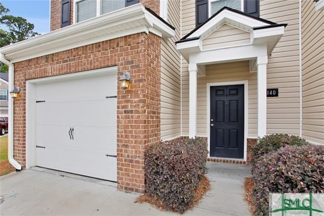 view of exterior entry featuring a garage