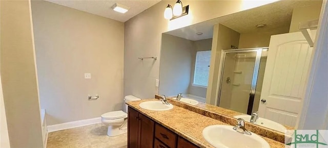 full bathroom with a textured ceiling, tile patterned floors, vanity, toilet, and separate shower and tub