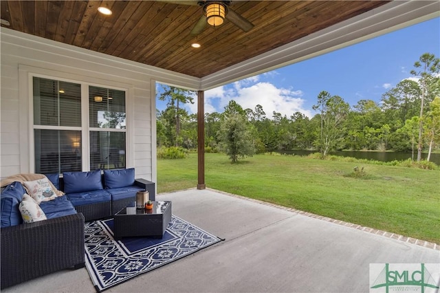 view of patio with outdoor lounge area and ceiling fan