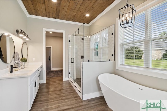 bathroom featuring independent shower and bath, hardwood / wood-style floors, wooden ceiling, ornamental molding, and vanity