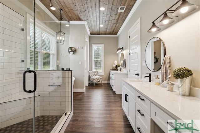 bathroom featuring plenty of natural light, wood-type flooring, ornamental molding, and wood ceiling