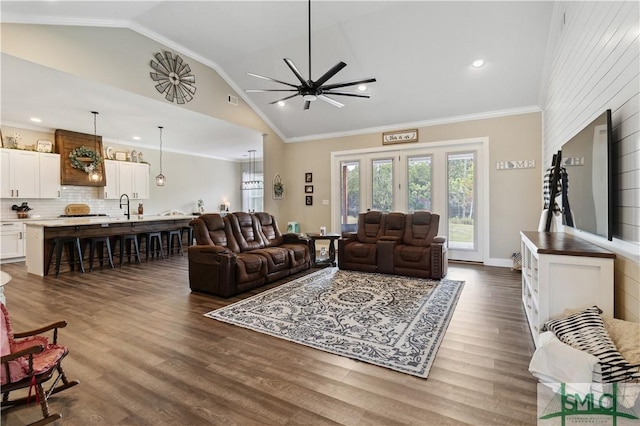 living room featuring visible vents, ornamental molding, baseboards, and dark wood-style flooring