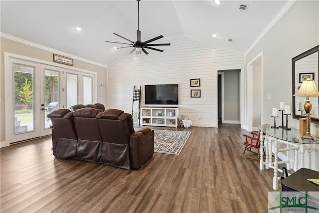 living area with visible vents, an accent wall, dark wood-style flooring, and crown molding