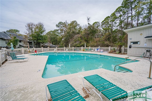 view of swimming pool with a patio area