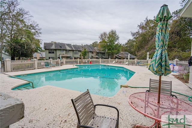 view of swimming pool featuring a patio