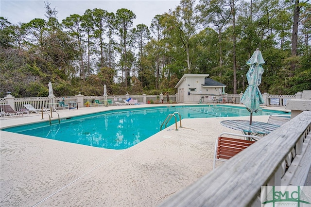 view of swimming pool with a patio area