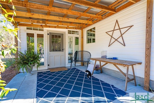 entrance to property featuring a patio