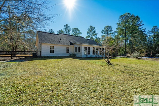 back of house with a yard