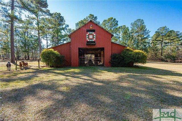 view of outbuilding with a lawn