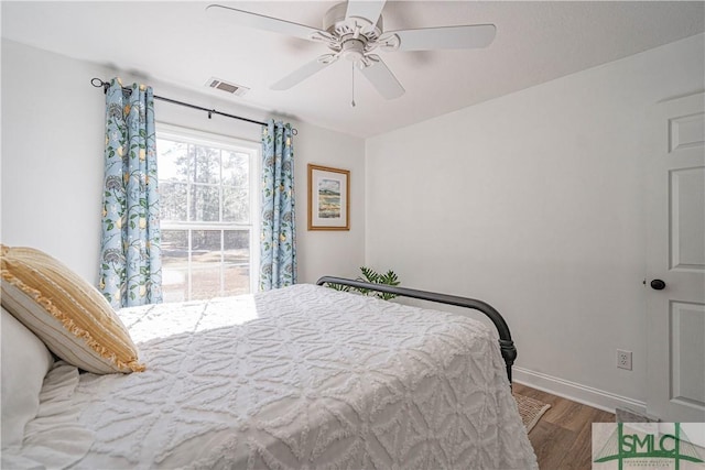 bedroom featuring ceiling fan and wood-type flooring