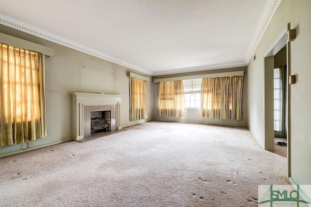 unfurnished living room featuring carpet and crown molding