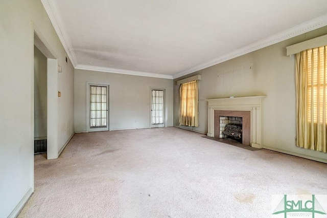 unfurnished living room with light colored carpet and ornamental molding