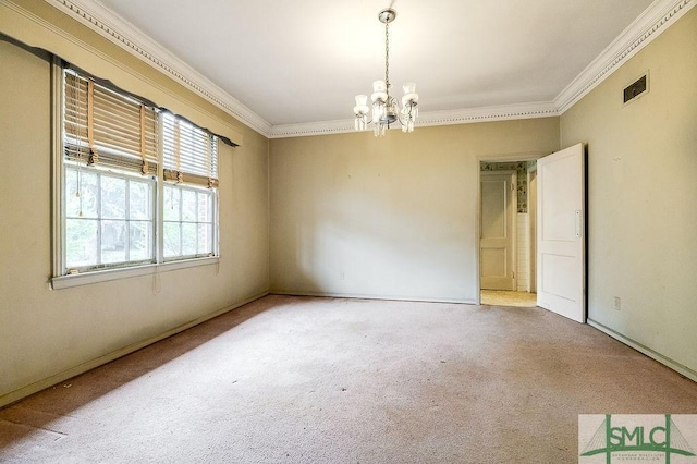 spare room with ornamental molding, a chandelier, and carpet flooring