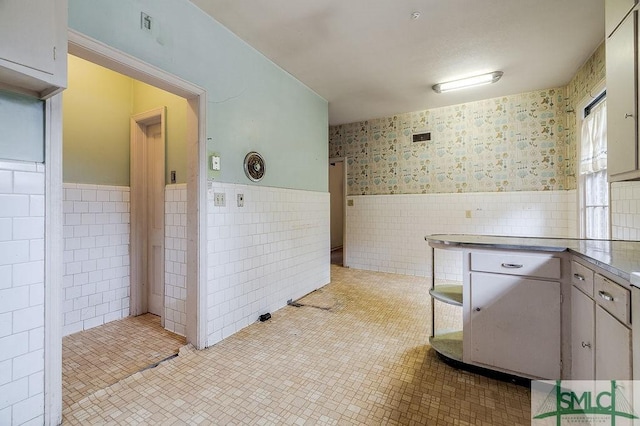 kitchen featuring tile walls