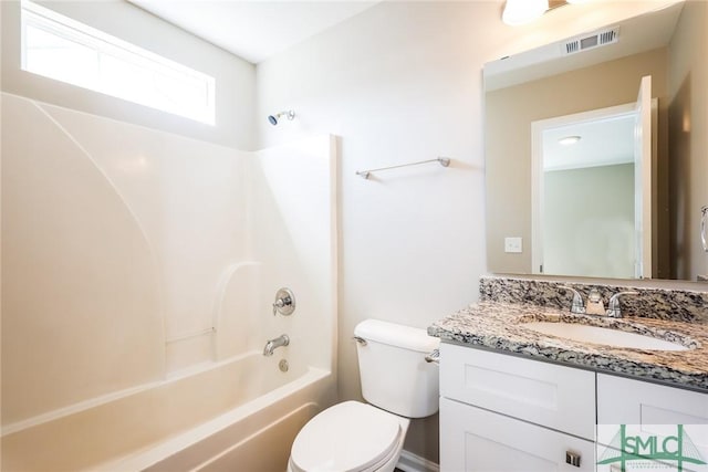 full bath featuring visible vents, bathing tub / shower combination, toilet, and vanity