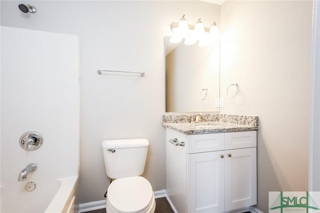 bathroom with shower / tub combination, vanity, and toilet