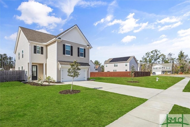 view of front of home featuring a front yard and a garage