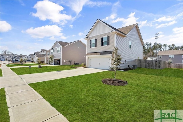 view of front of property featuring a front yard, central AC unit, and a garage