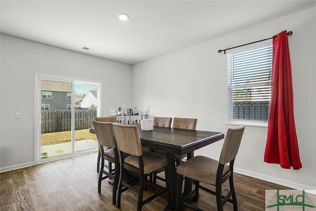 dining space featuring hardwood / wood-style floors