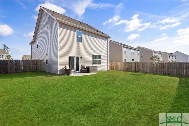 back of property with a patio and a lawn