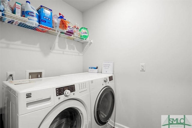 clothes washing area featuring washer and clothes dryer