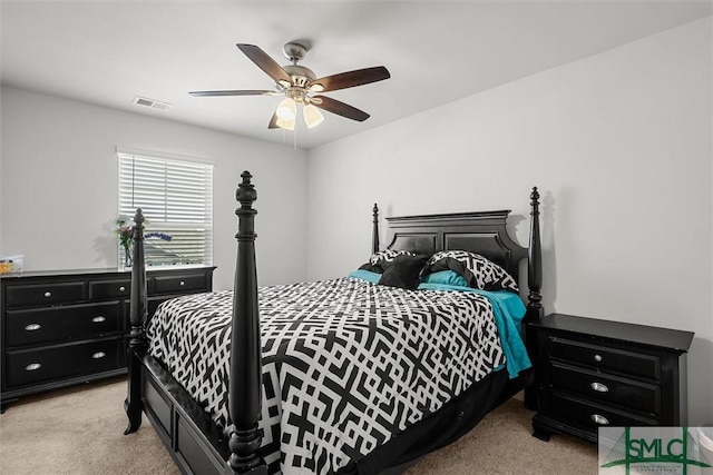 bedroom featuring light carpet and ceiling fan