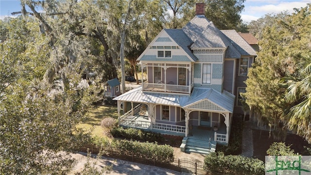 view of front of home with a balcony and a porch