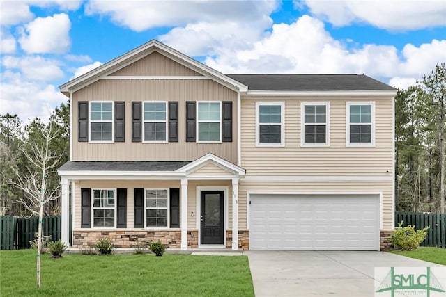 craftsman-style home with a garage and a front yard