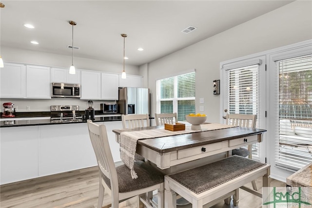 dining room featuring light hardwood / wood-style flooring