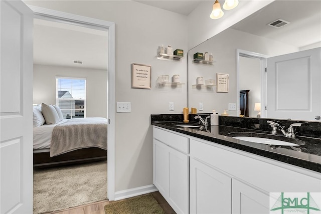 bathroom featuring hardwood / wood-style flooring and vanity