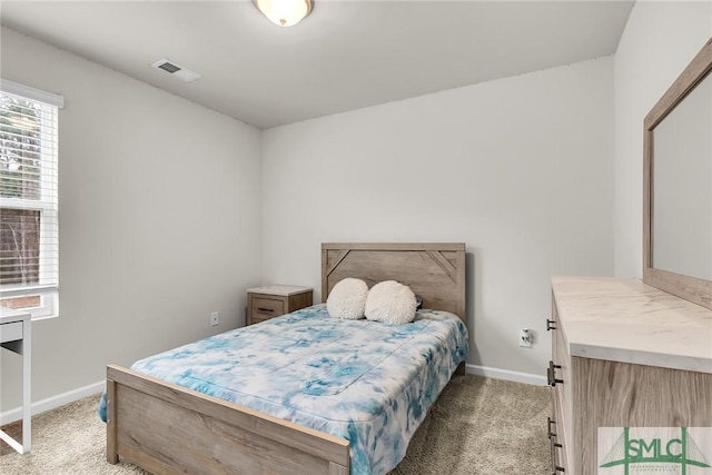 bedroom featuring light colored carpet