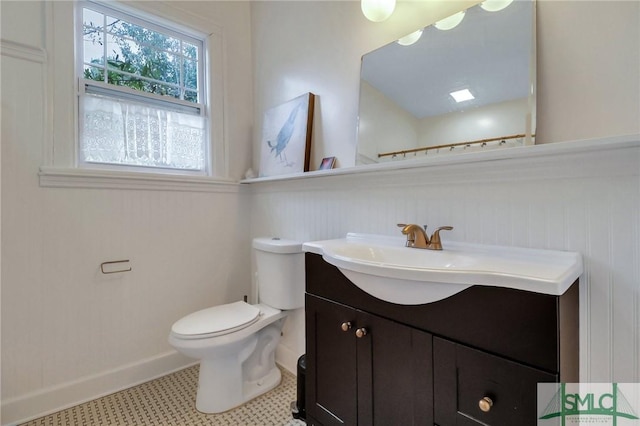 bathroom featuring vanity, toilet, and tile patterned floors