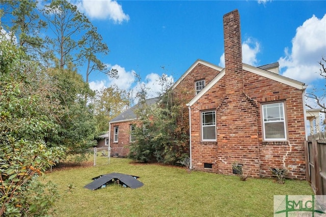 back of house featuring a yard