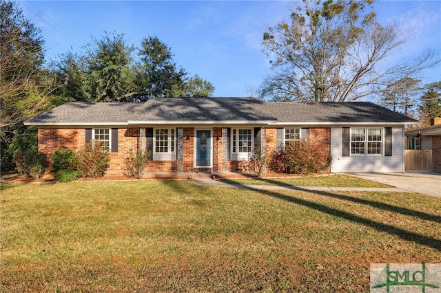 ranch-style home with a front lawn