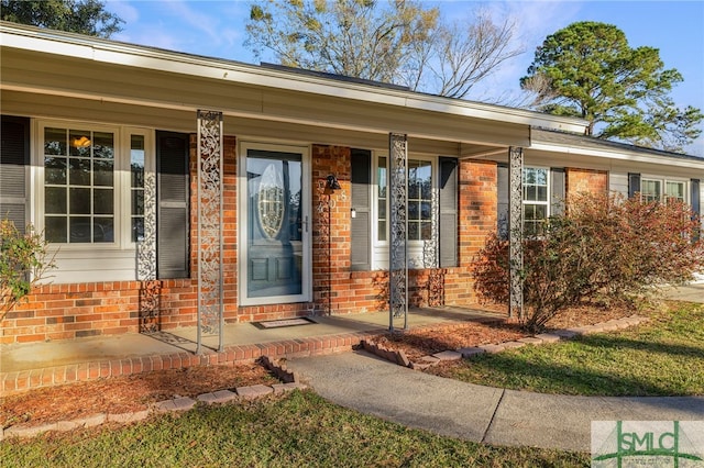 entrance to property featuring a porch