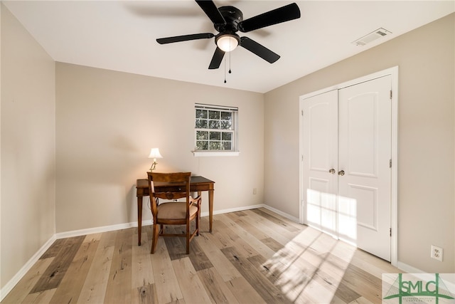 office featuring light wood-type flooring and ceiling fan