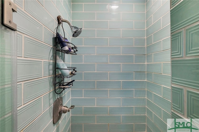 bathroom with a tile shower