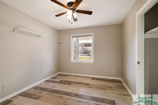 unfurnished room with ceiling fan and light hardwood / wood-style flooring