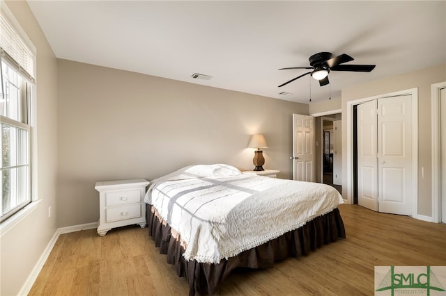 bedroom with ceiling fan and light hardwood / wood-style floors