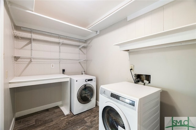 laundry area featuring washer and clothes dryer and dark hardwood / wood-style flooring