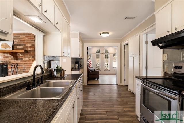 kitchen featuring stainless steel electric stove, white cabinets, dark hardwood / wood-style flooring, sink, and ornamental molding