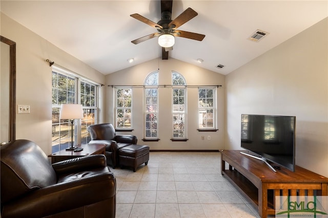 living room featuring light tile patterned flooring, vaulted ceiling with beams, and ceiling fan