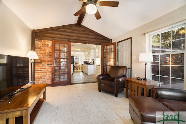 living room with rustic walls, light tile patterned floors, french doors, ceiling fan, and lofted ceiling with beams