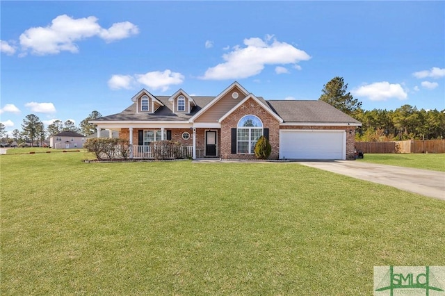 view of front of home featuring a garage, a front lawn, and a porch