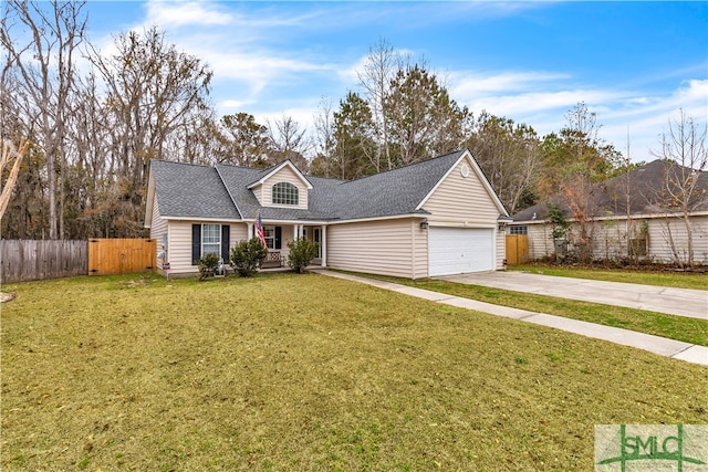 view of front of house with a garage and a front lawn