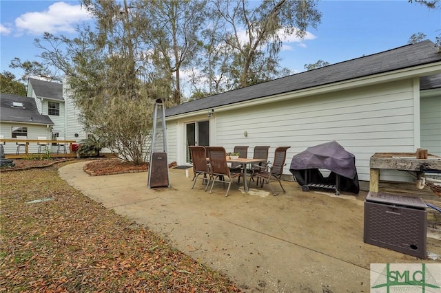 rear view of property featuring a patio